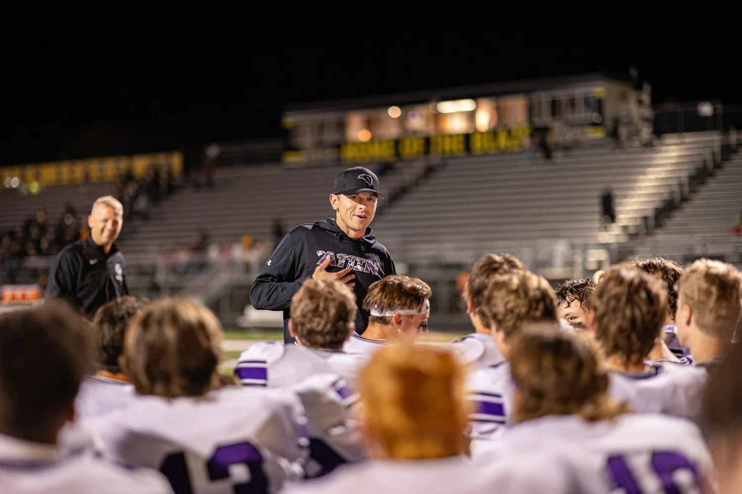 Coach talks to the team after the game