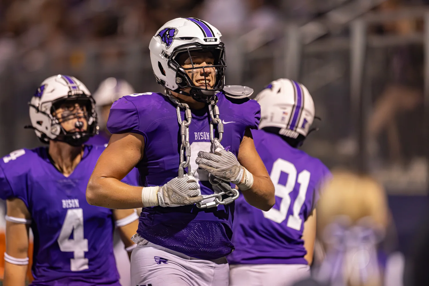 Defensive player running with the turnover chain