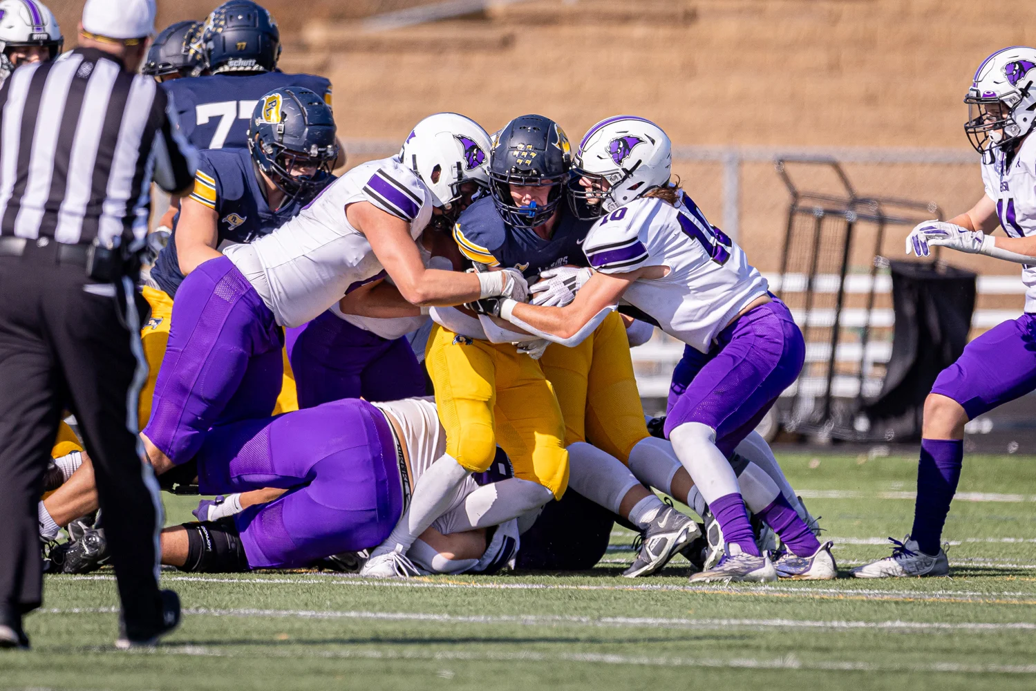 Bison defenders stopping the RB