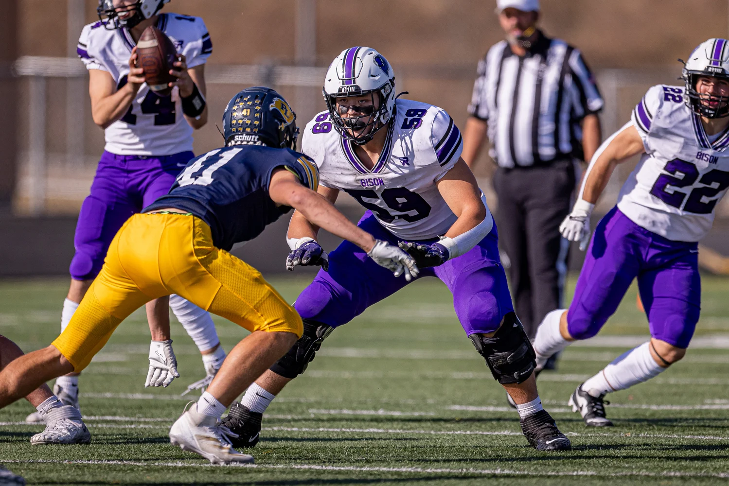 Offensive lineman looking to block the defender