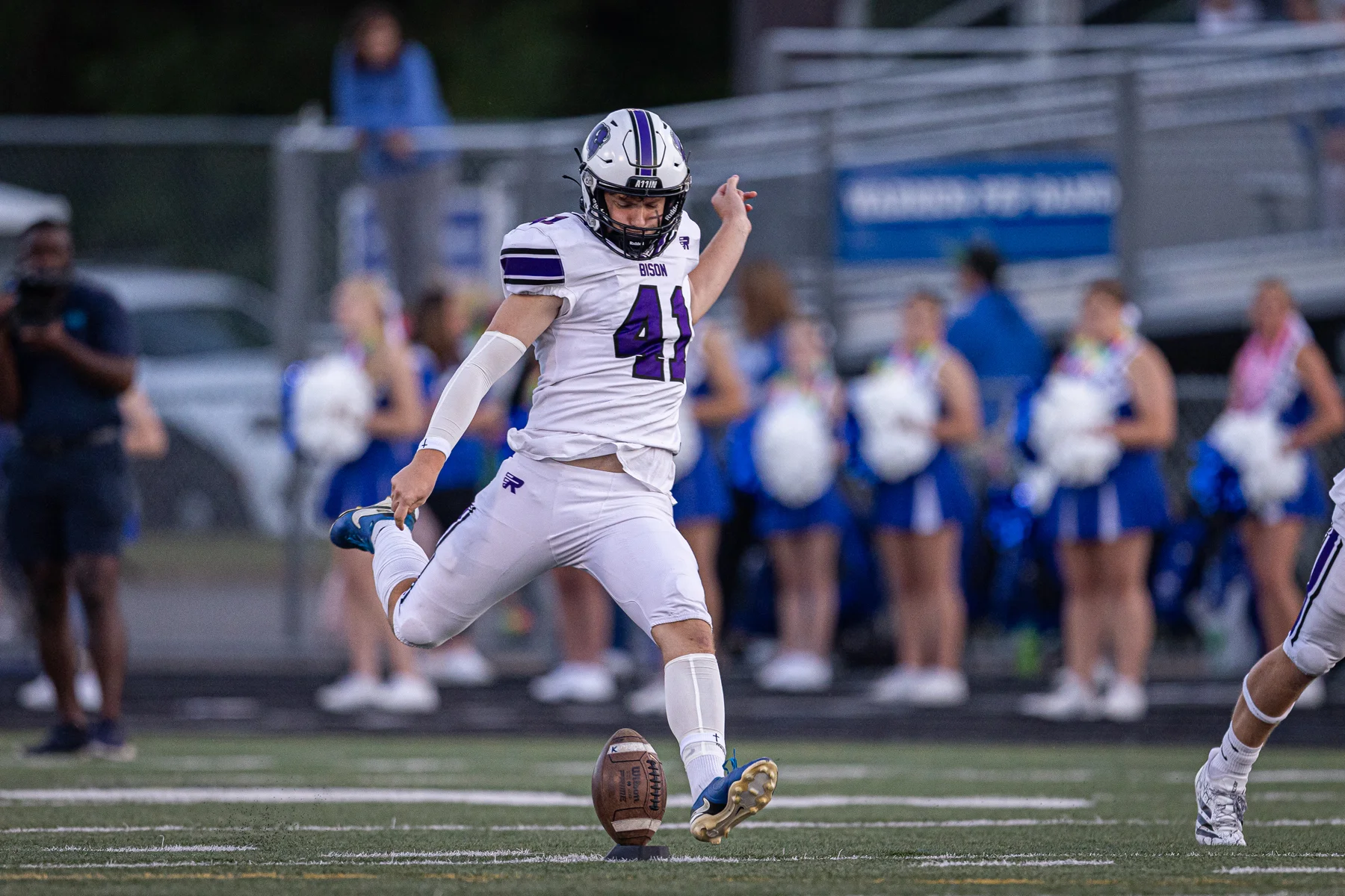 Kicker kicking the ball at the kickoff